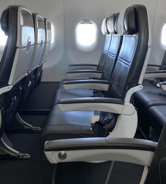 Economy Airplane Seat Row Highlighting Legroom