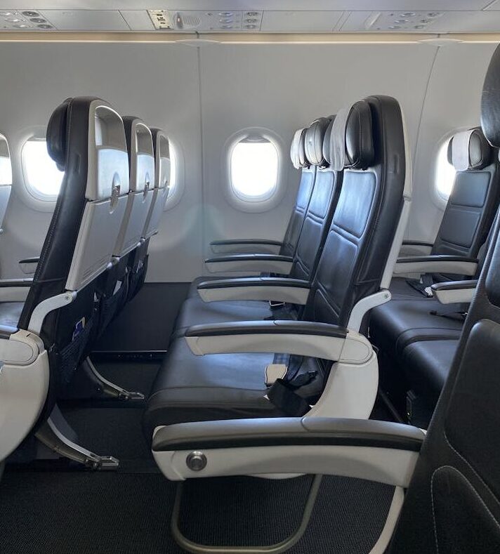 Economy Airplane Seat Row Highlighting Legroom