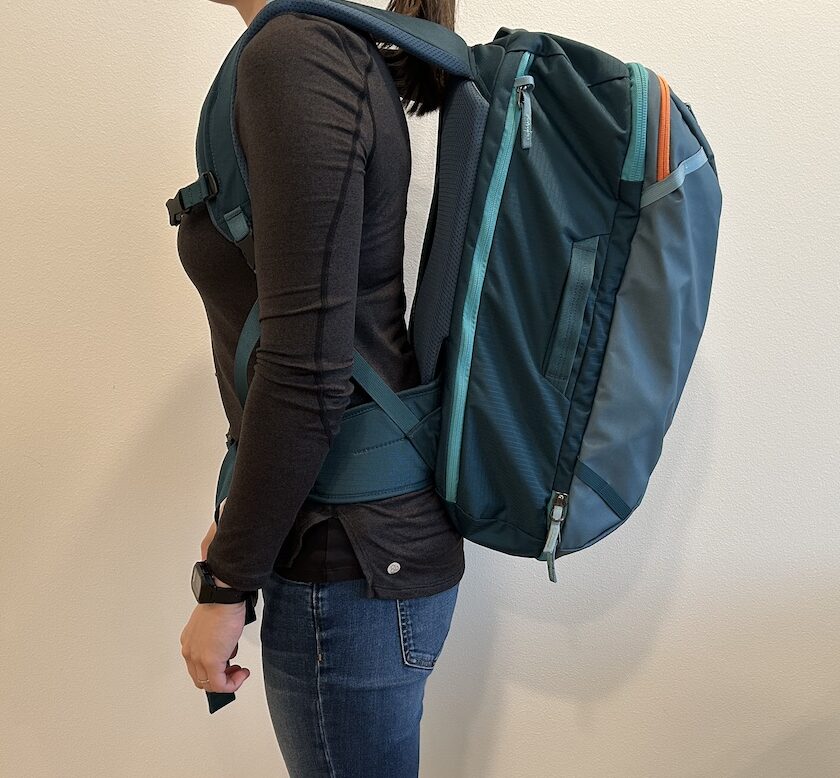photo of person wearing travel backpack with hip belt secured but not chest strap